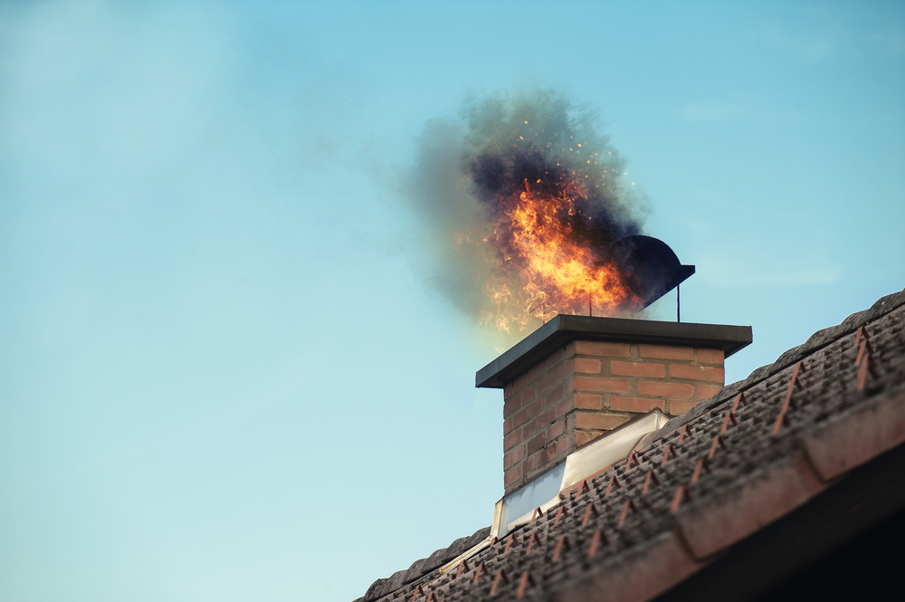Chimney with fire coming out of the top